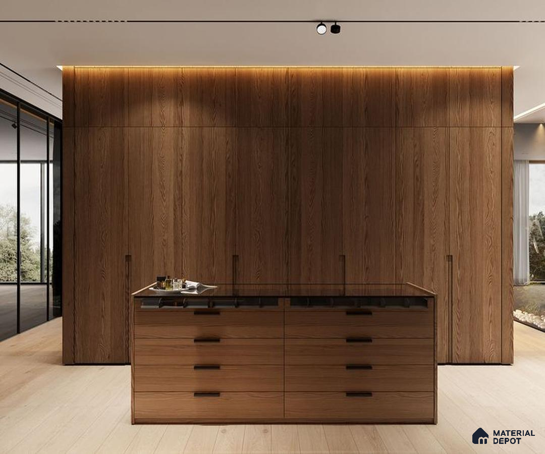 A kitchen with marble counter tops and stainless steel appliances on the wall, along with hanging lights hanging from the ceiling over the ceiling in front of a wooden counter top of a white counter top oven and white